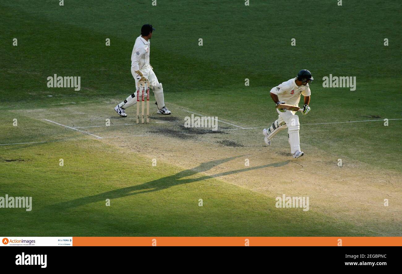Cricket - Australia v England First Test - 3 Mobile Ashes Test Series 2006-07 - The Gabba, Brisbane, Australia - 25/11/06  Australian batsman  Justin Langer goes through for a single near the close of play  Mandatory Credit: Action Images / Jason O'Brien  Livepic Stock Photo