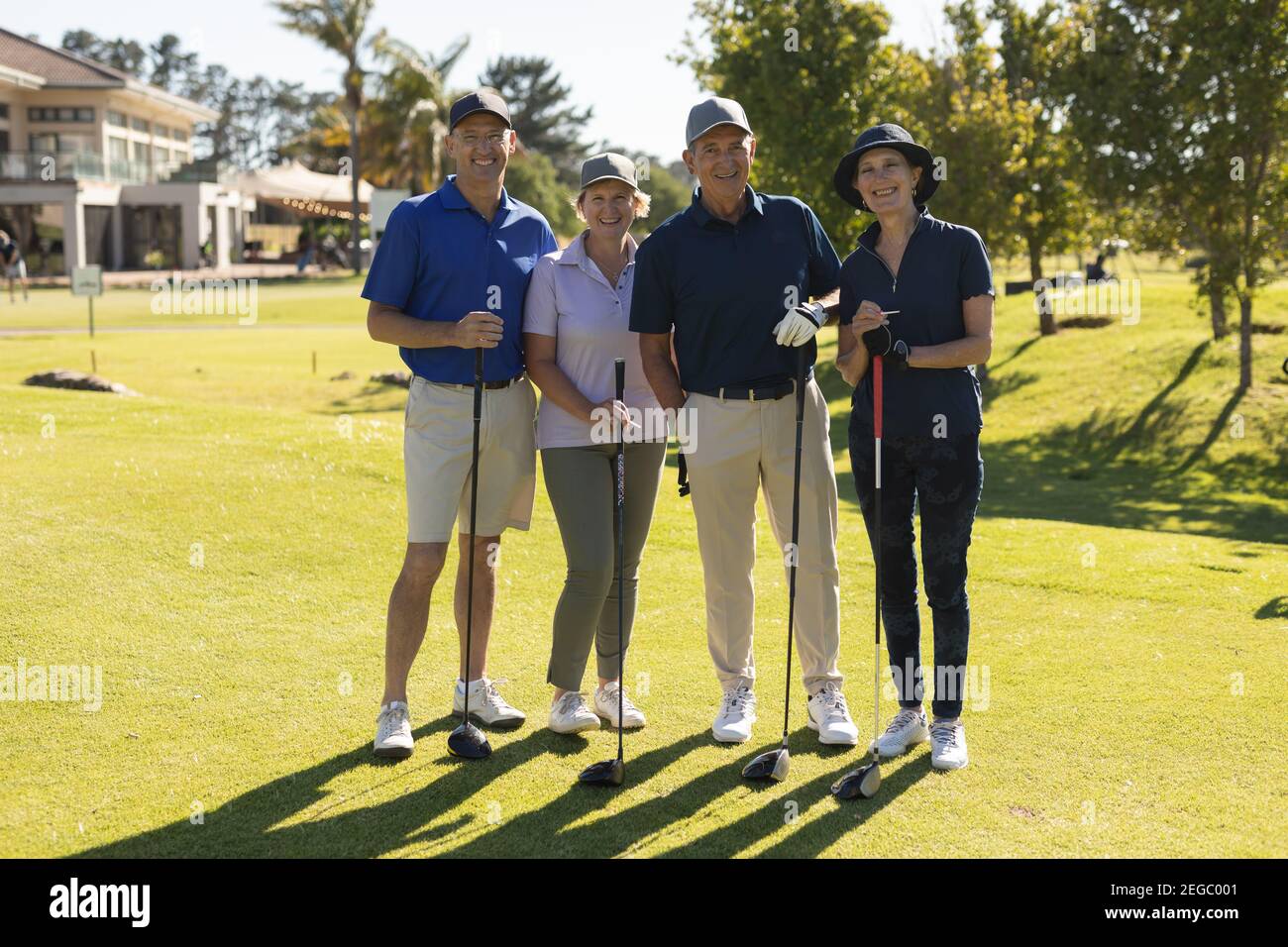 Four caucasian senior men and women looking at the camera and smiling Stock Photo