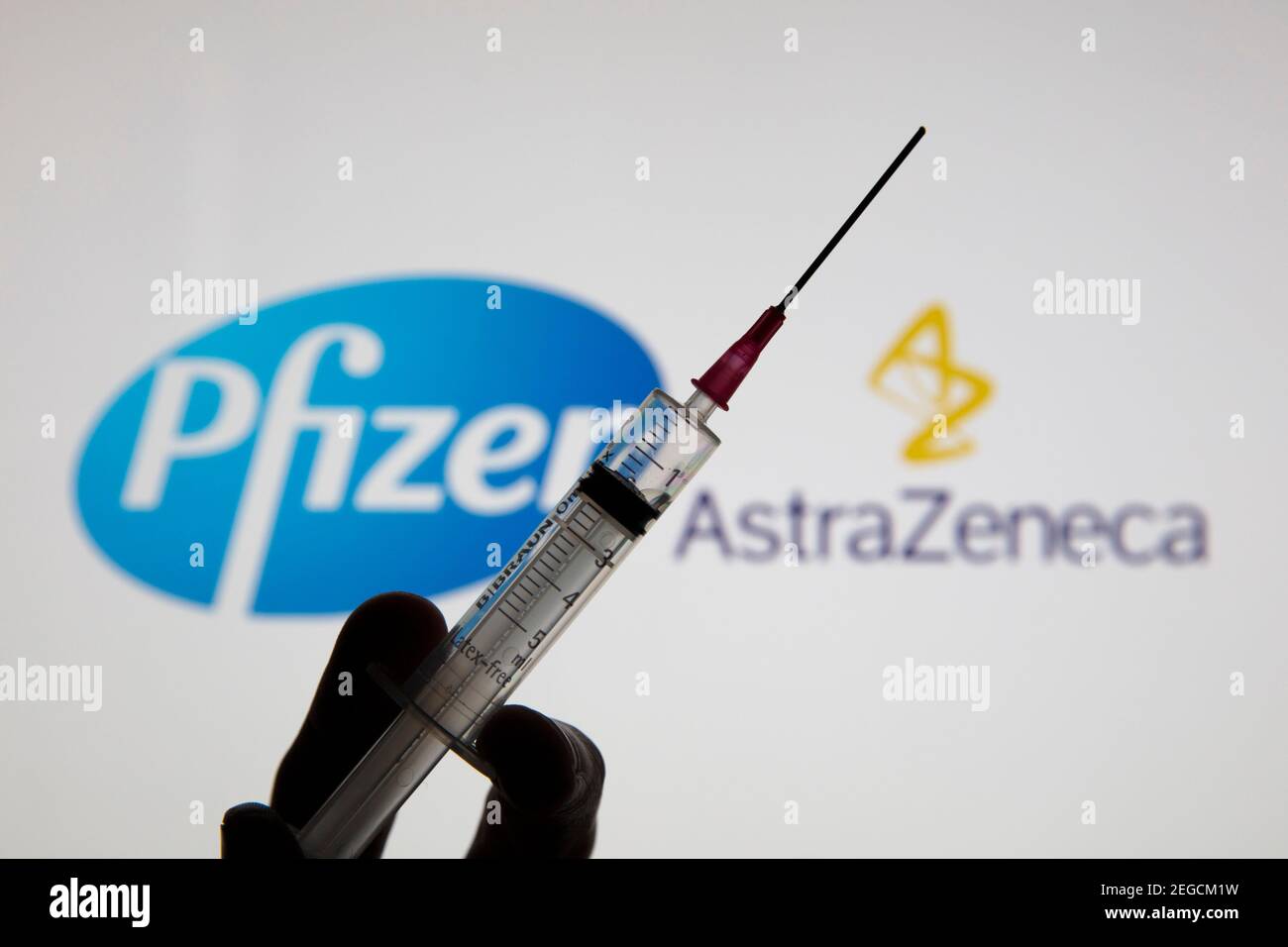 OXFORD, UK - February 2020: Pfizer and Astraeneca logos with covid-19 vaccine Stock Photo