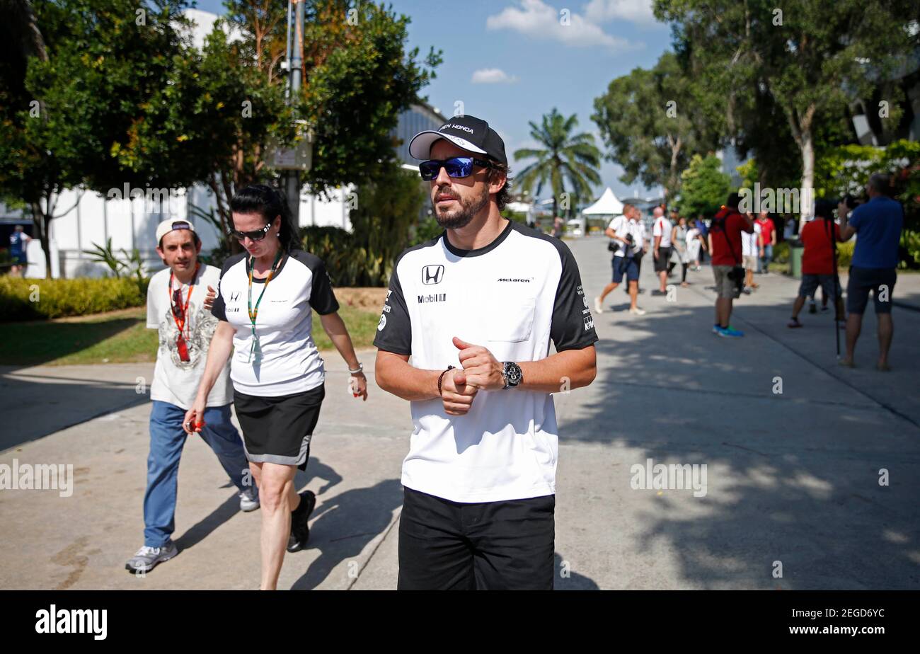 Formula One - F1 - Malaysian Grand Prix 2015 - Sepang International Circuit, Kuala Lumpur, Malaysia - 26/3/15  McLaren's Fernando Alonso walking in the paddock  Reuters / Olivia Harris  Livepic Stock Photo
