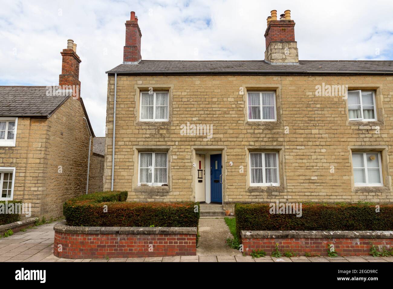 Direct view of a pair of cottages in the Railway Village, Swindon, Wiltshire, UK. Stock Photo