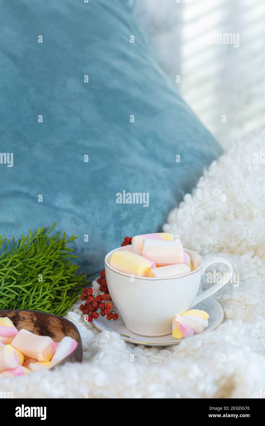 Pillow, a cup of coffee, verifying green spruce, Marshmallow Still life, bedding. High quality photo Stock Photo