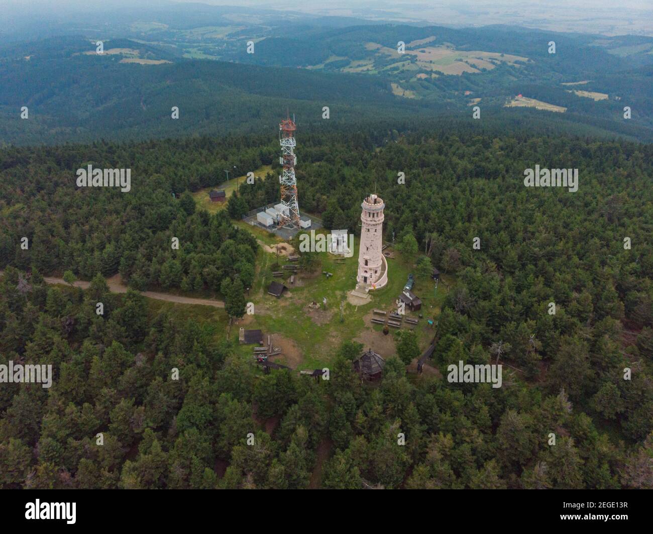 Pieszyce August 20 2019 Aerial drone view to Peak of Wielka Sowa mountain with towers between trees Stock Photo