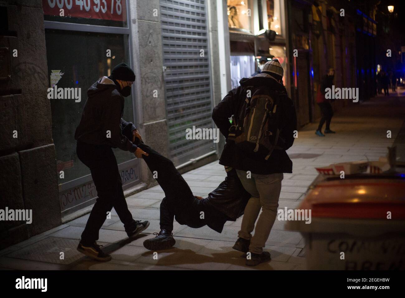 The police detain one of the protesters during the riots in Madrid ...