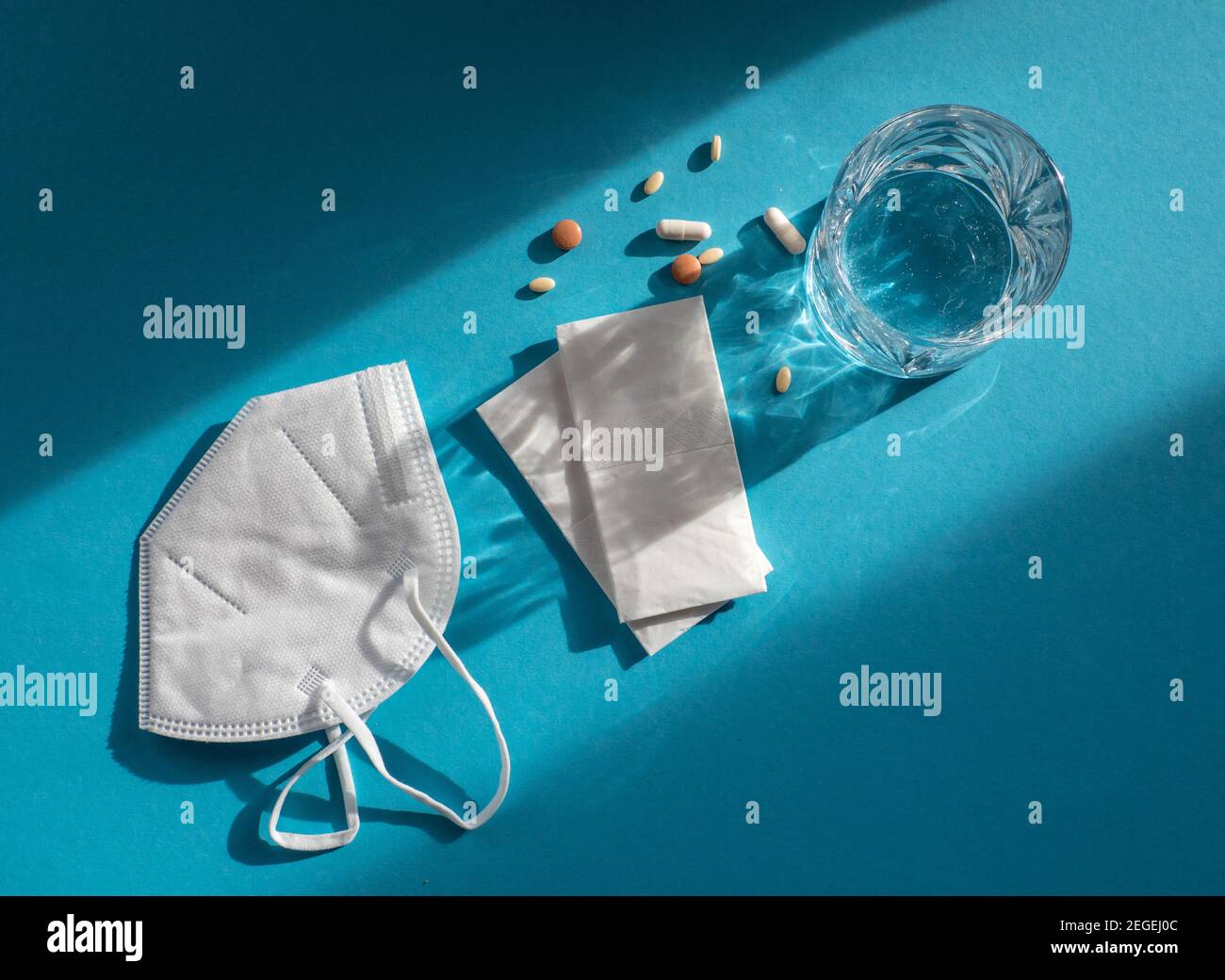 Medicine, water and tissues for a possible Corona infection or cold Stock Photo