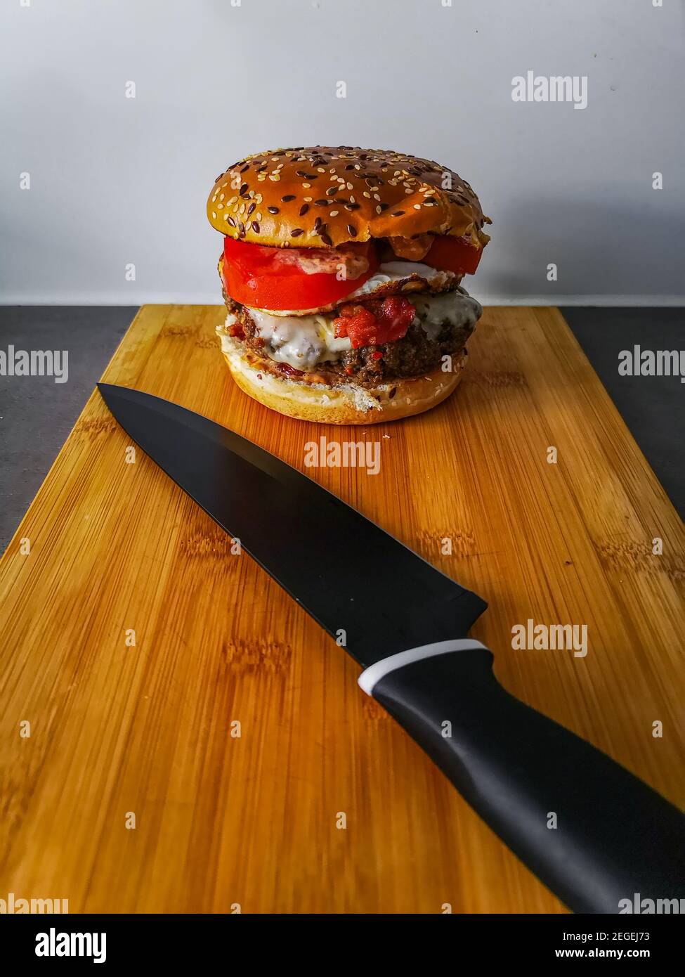 Professional chef knife, peeling knife and sharpening steel on wood cutting  board over a kitchen table. Chef working tools. Modern kitchen utensils  Stock Photo - Alamy