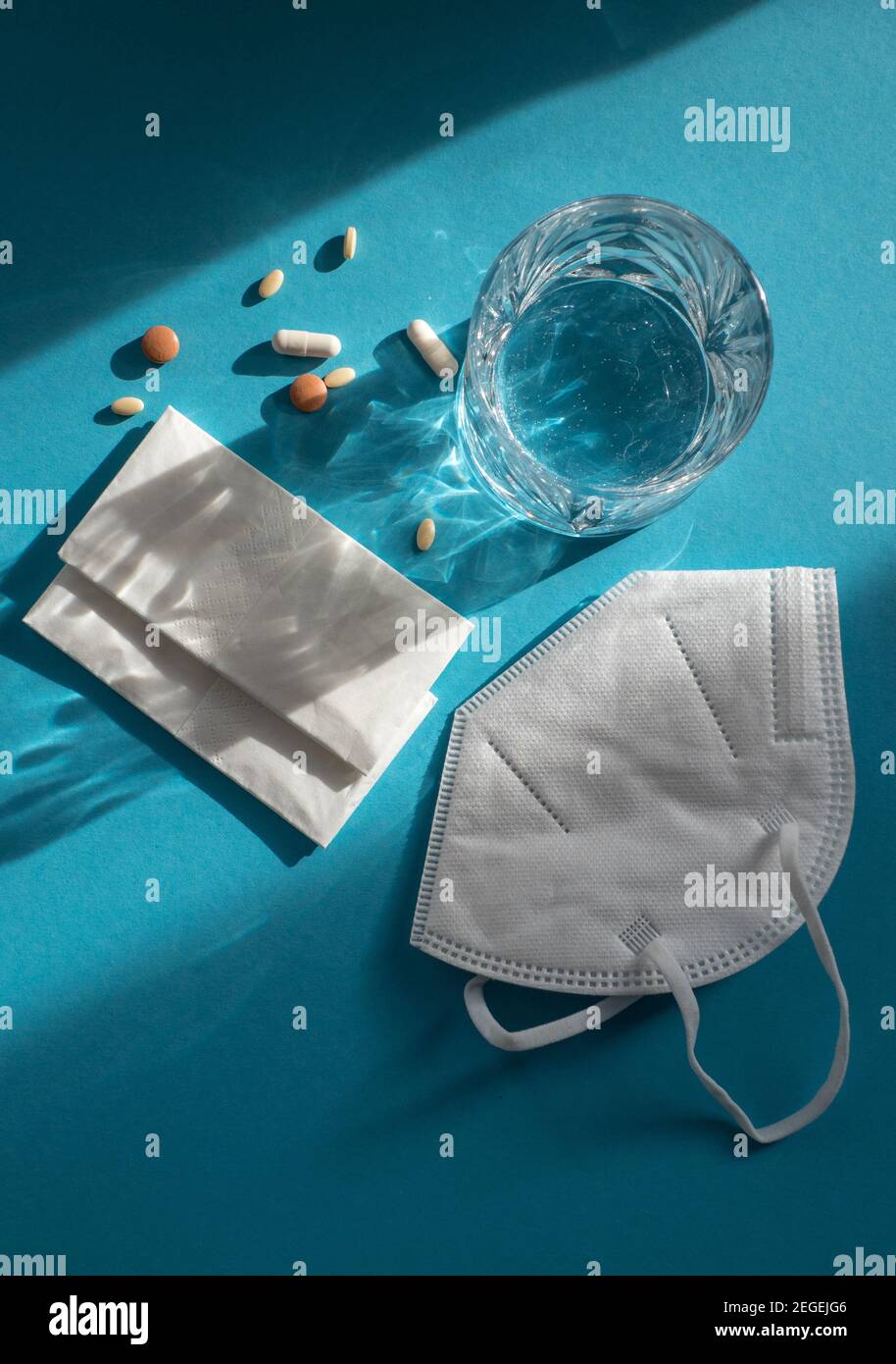 Medicine, water and tissues for a possible Corona infection or cold Stock Photo