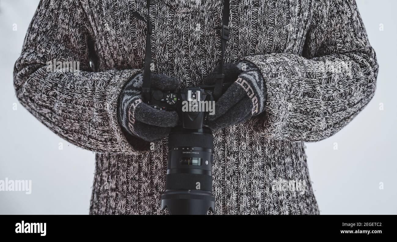 Ready with the camera to take pictures during the winter days outdoors Stock Photo