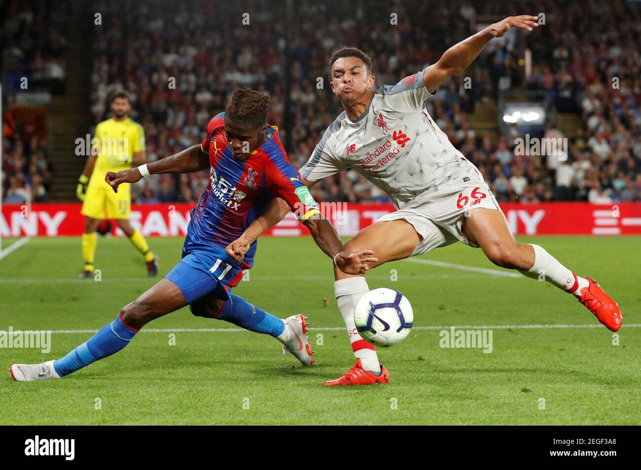 Soccer Football - Premier League - Crystal Palace v Liverpool - Selhurst Park, London, Britain - August 20, 2018  Crystal Palace's Wilfried Zaha in action with Liverpool's Trent Alexander-Arnold                          Action Images via Reuters/John Sibley  EDITORIAL USE ONLY. No use with unauthorized audio, video, data, fixture lists, club/league logos or 'live' services. Online in-match use limited to 75 images, no video emulation. No use in betting, games or single club/league/player publications.  Please contact your account representative for further details. Stock Photo