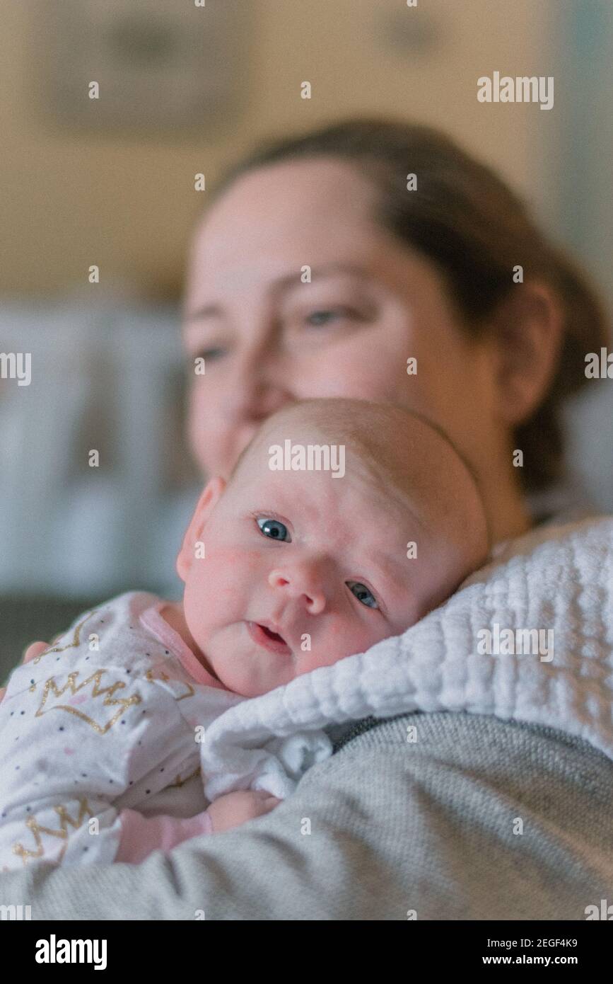 Three month old baby with mother Stock Photo