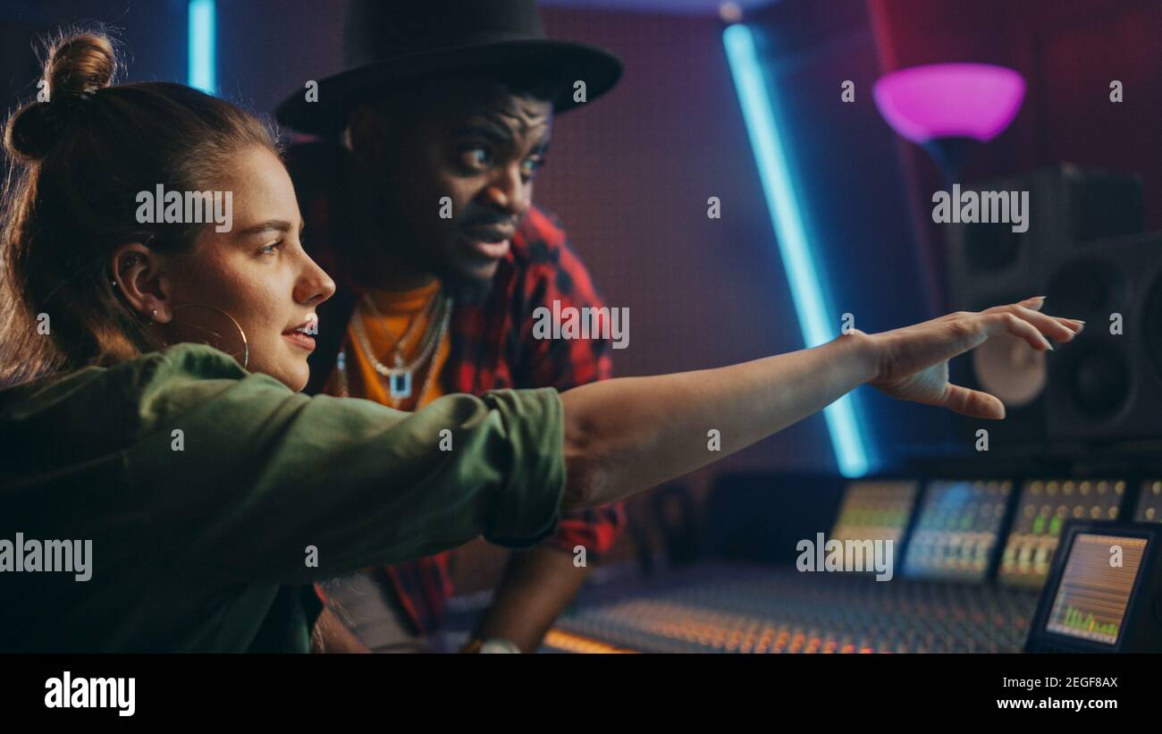 Stylish Producer and Audio Engineer Working together in Music Recording ...