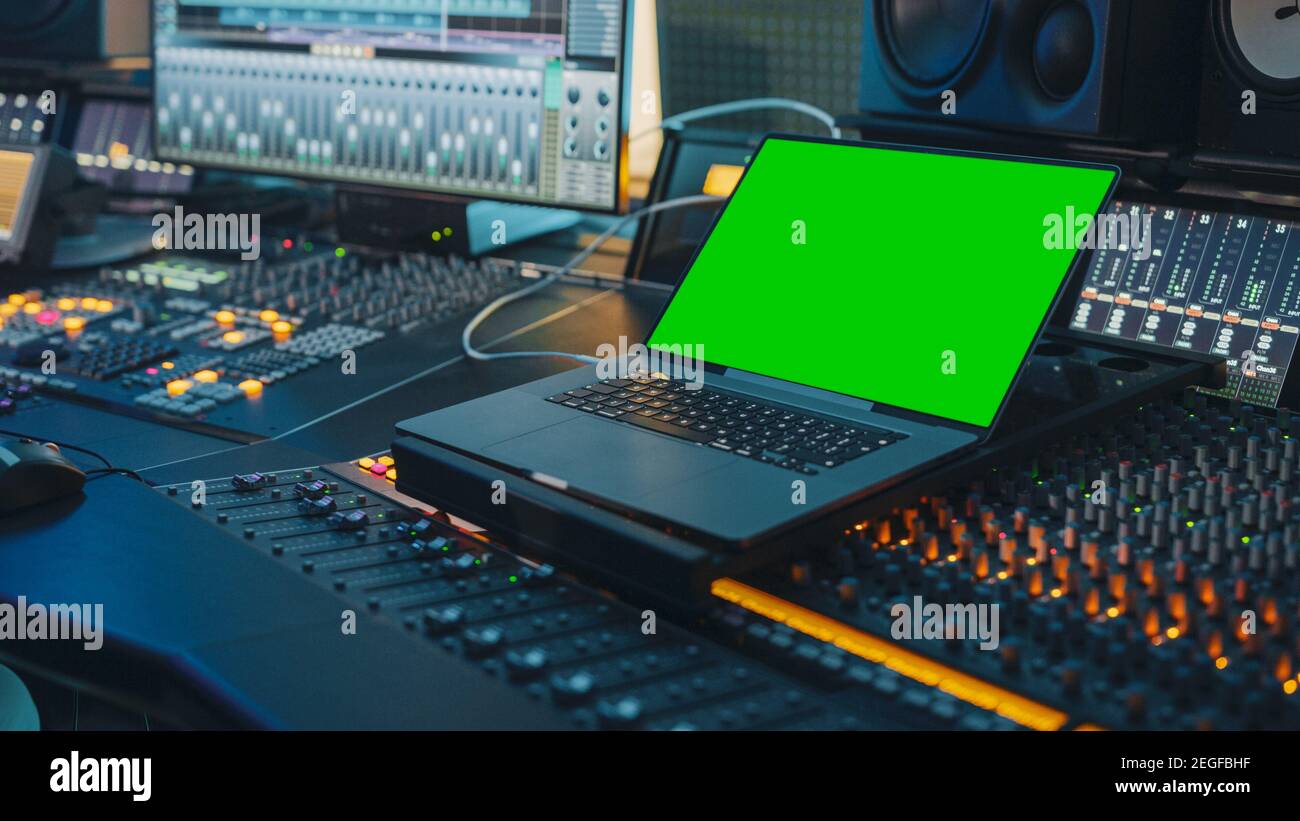 Modern Music Record Studio Control Desk with Green Screen Chroma Key Laptop,  Equalizer, Mixer and other Professional Equipment. Switchers, Buttons Stock  Photo - Alamy