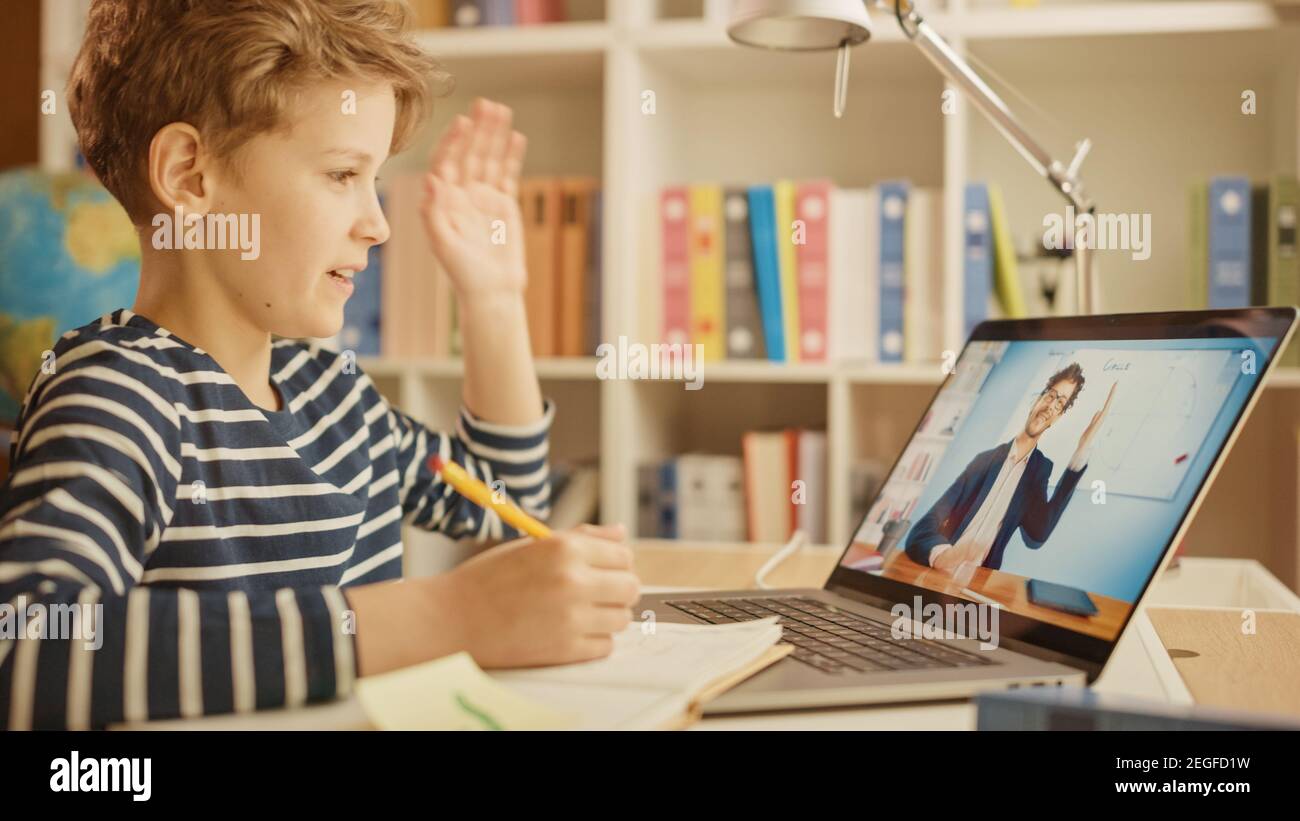 Smart Little Boy Uses Laptop for Video Call with His Teacher. Screen ...