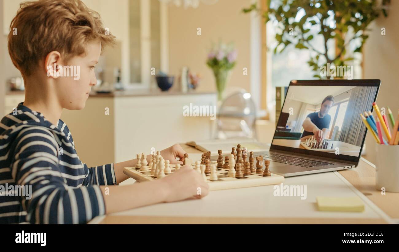 Brilliant Little Boy Playing Chess with His Chess Master, Uses Laptop for  Video Call. Remote Online Education, E-Education, Distance Learning Stock  Photo - Alamy