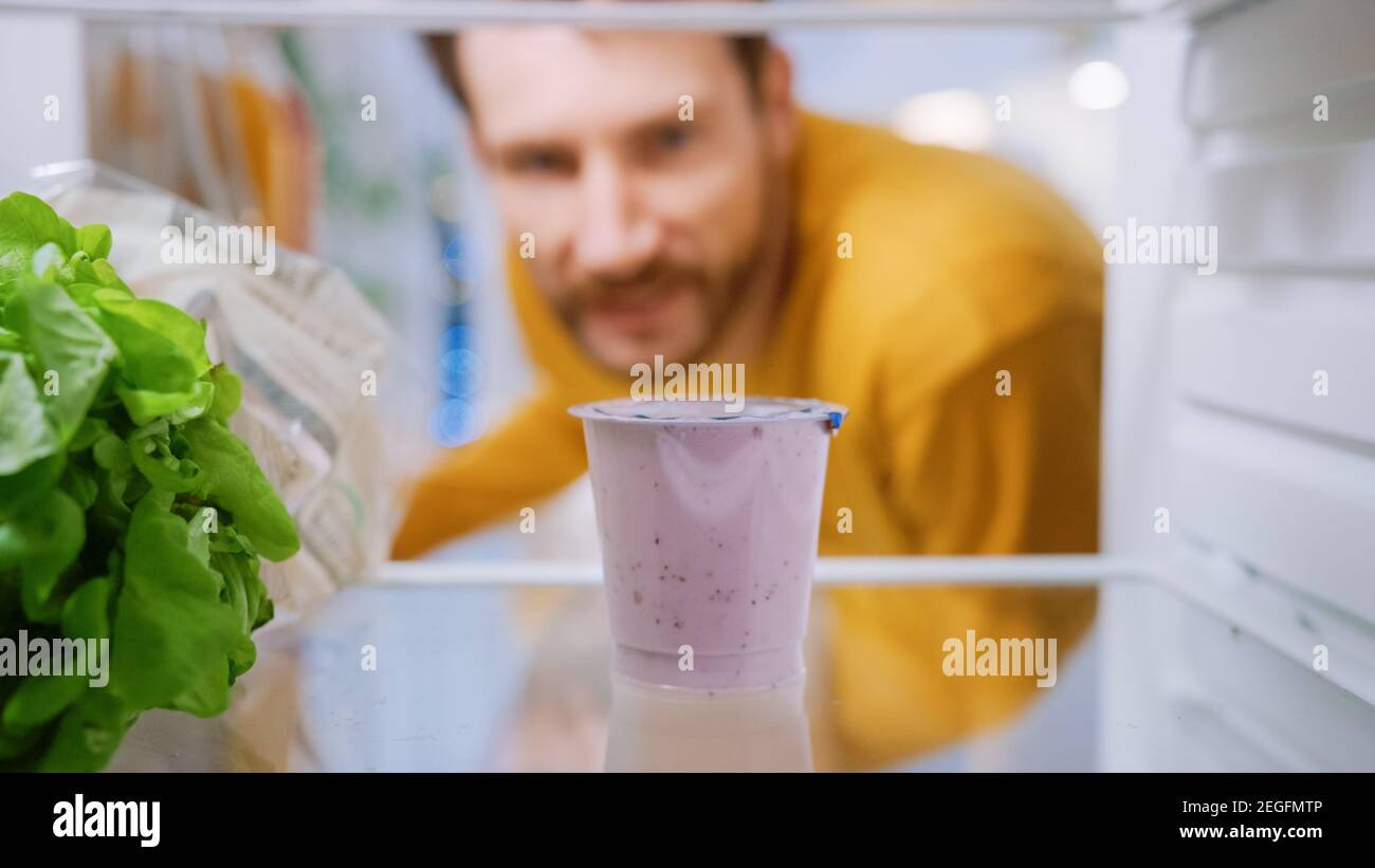 Camera Inside Kitchen Fridge Handsome Man Opens Fridge Door, Thinks to
