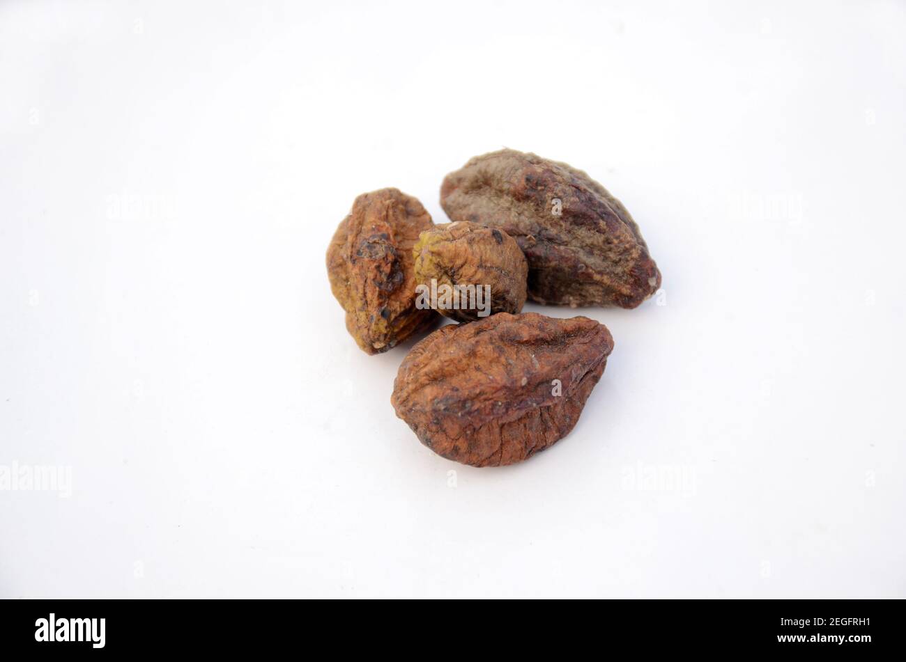 Closeup of brown dried harad fruit isolated on white background Stock Photo