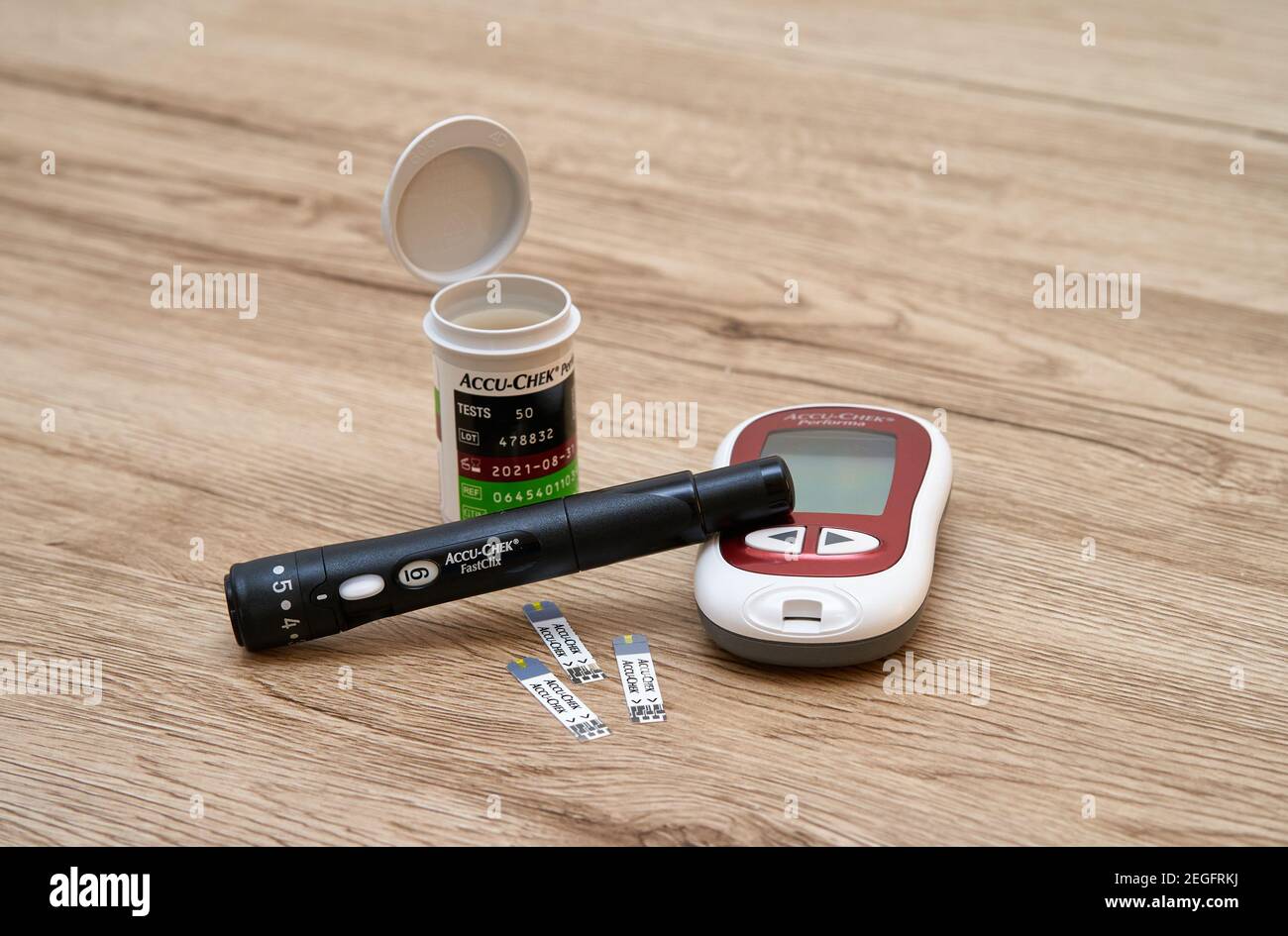 Equipment Accu-Check for measuring blood sugar at home - glucometer test strips and lancet. Stock Photo