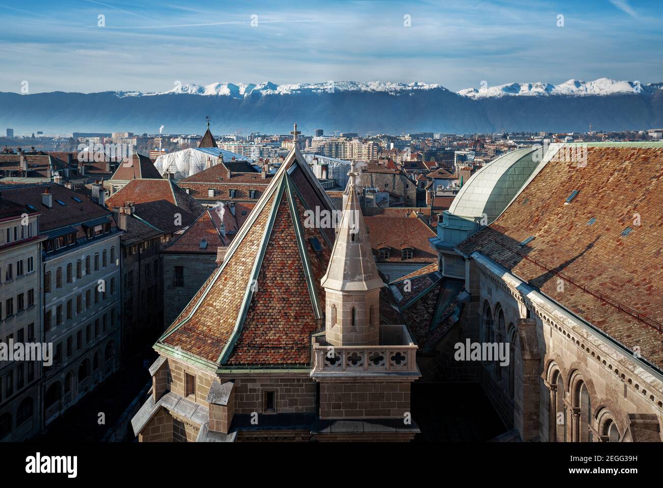 Aerial view of Geneva and St Pierre Cathedral with Alps Mountains on background - Geneva, Switzerland Stock Photo