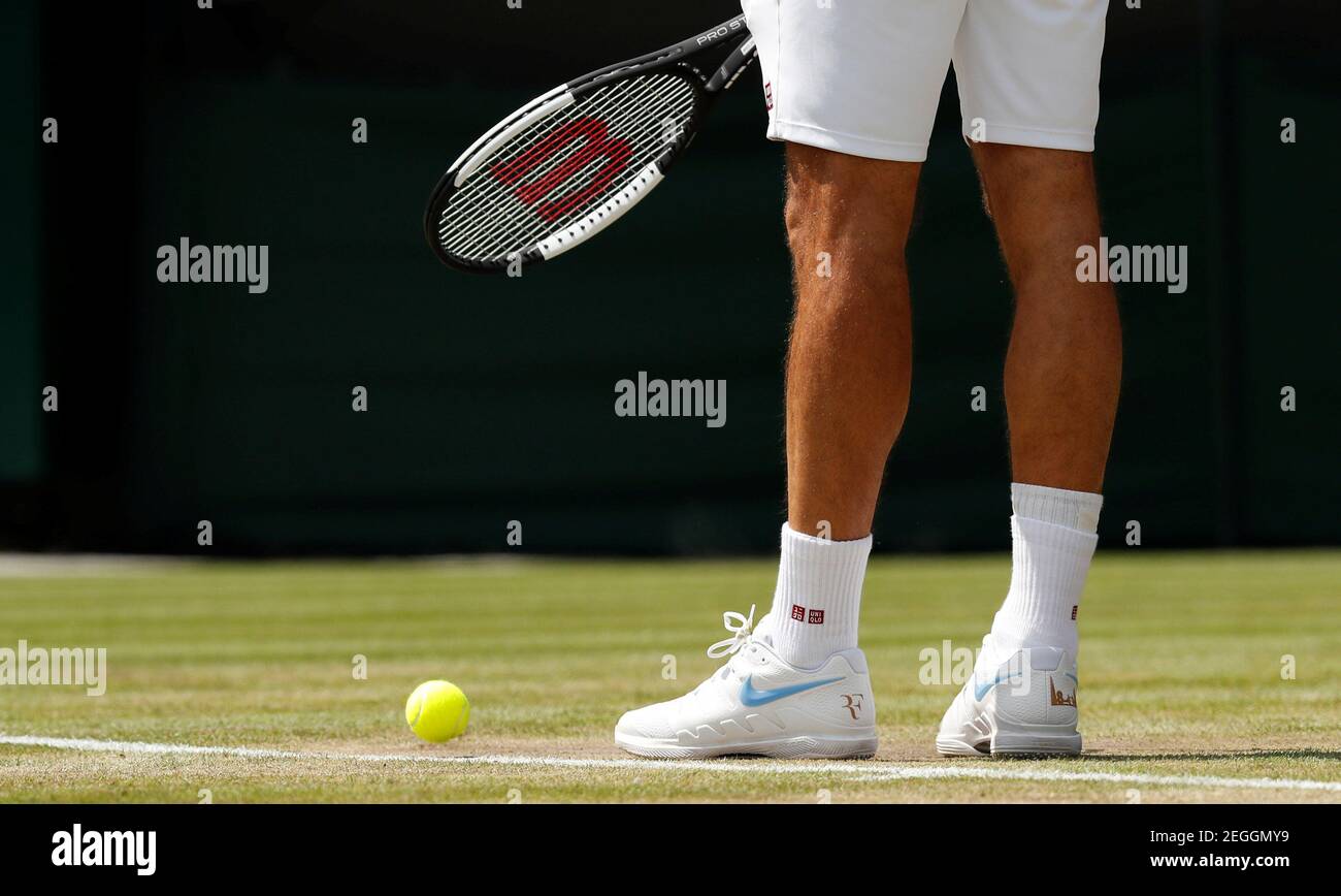 Tennis - Wimbledon - All England Lawn Tennis and Croquet Club, London,  Britain - July 11, 2018. Switzerland's Roger Federer's wears Uniqlo branded  socks and Nike tennis shoes during his quarter final