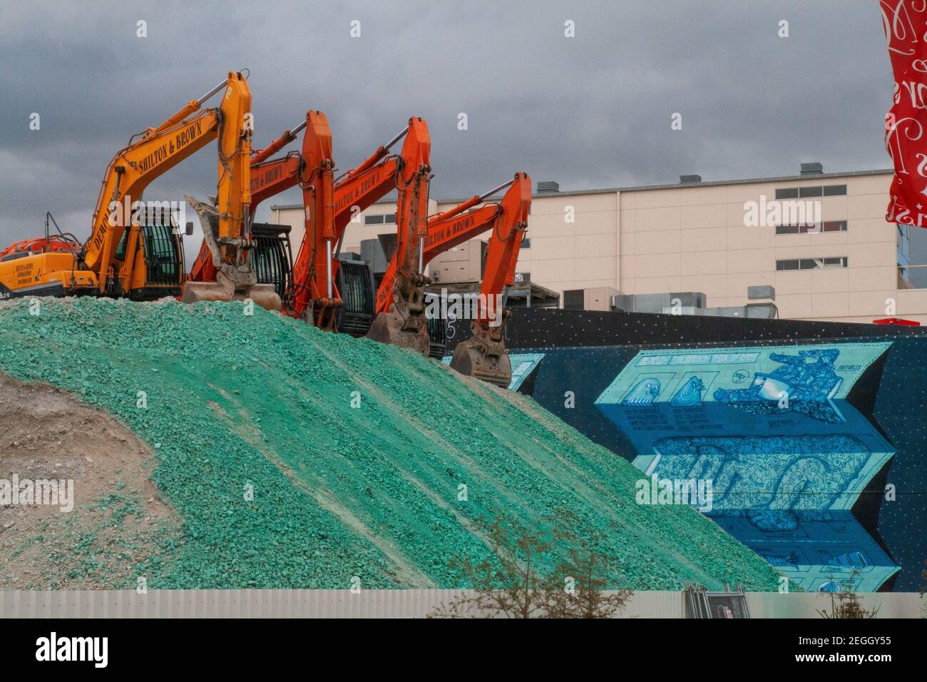 Group of excavators on gravel hill, city central recovery after Chirstchurch earthquake, New Zealand Stock Photo