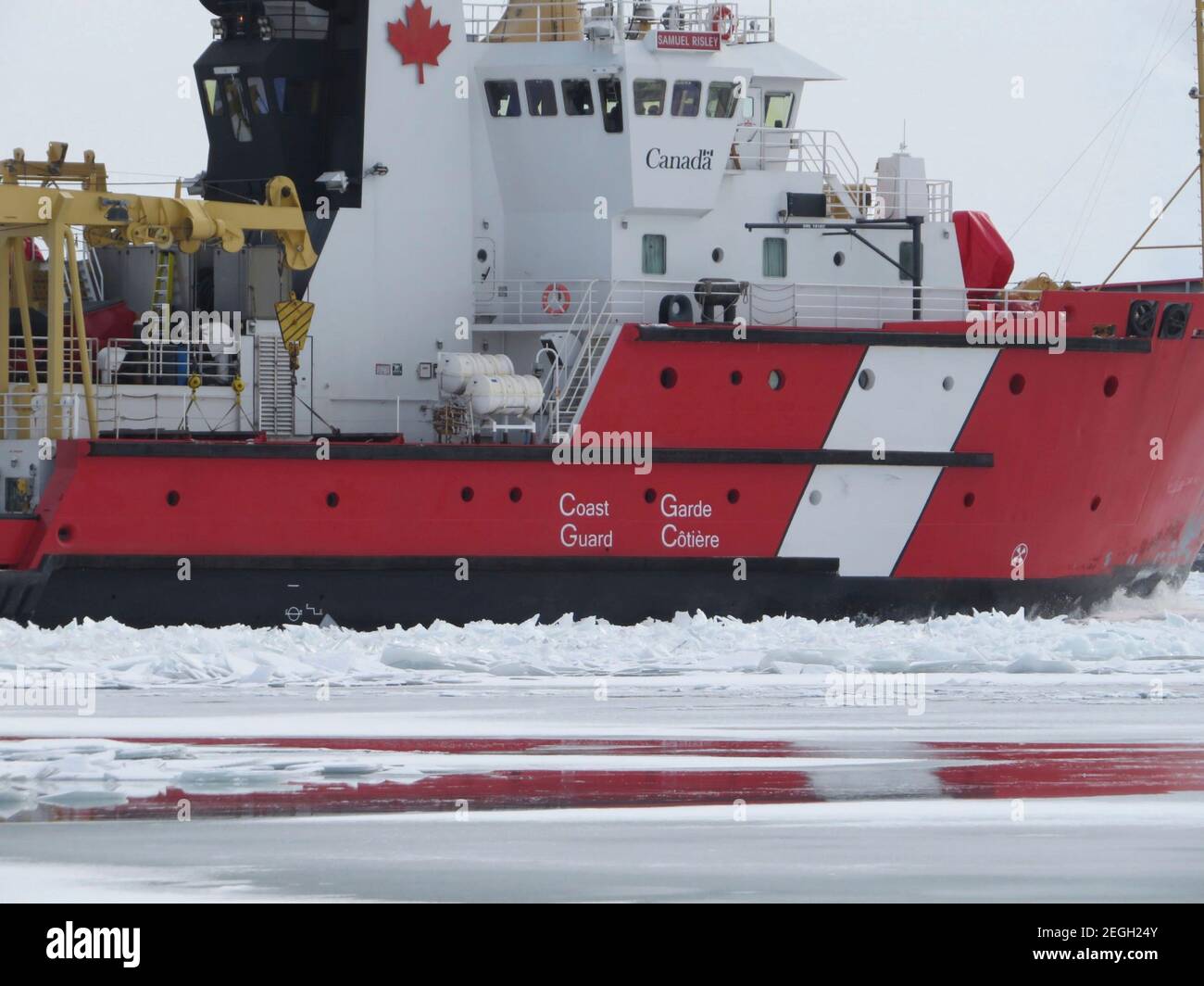 Canadian Coast Guard Ship Samuel Risley cuts through ice on the St. Clair River in support of Operation Coal Shovel February 10, 2021 near Detroit, Michigan. Operation Coal Shovel is an annual domestic ice-breaking mission conducted on Lakes Huron, Ontario, Erie, St. Clair, the St. Clair/Detroit river system and St. Lawrence Seaway. Stock Photo