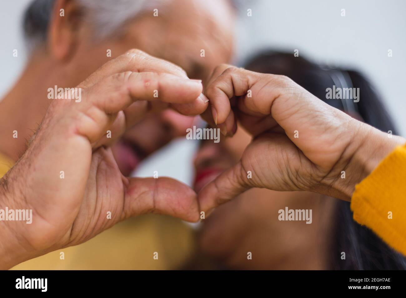 Close up of an Unrecognizable old couple doing a heart Stock Photo