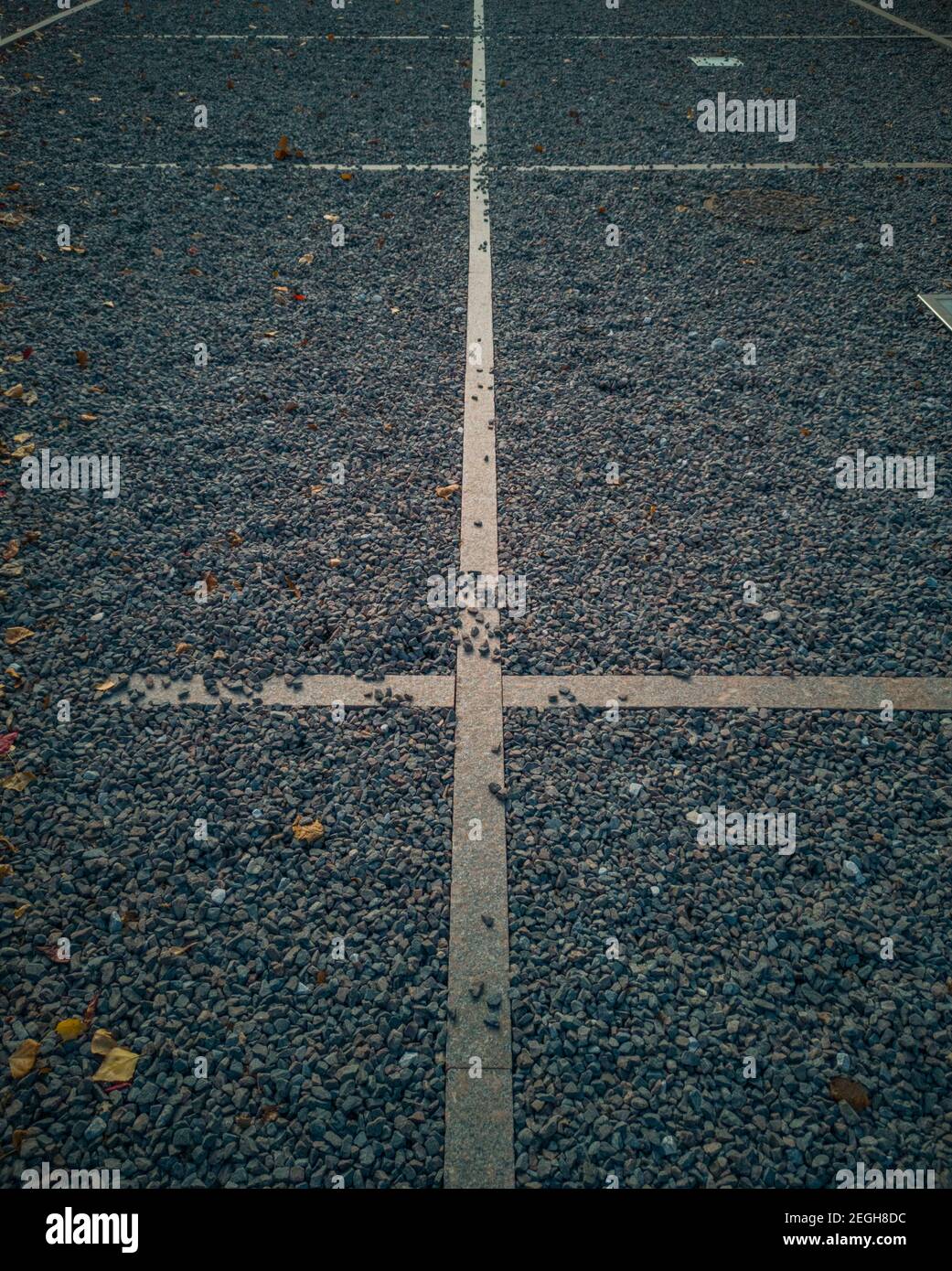 Concrete lines between holes with small stones Stock Photo Alamy