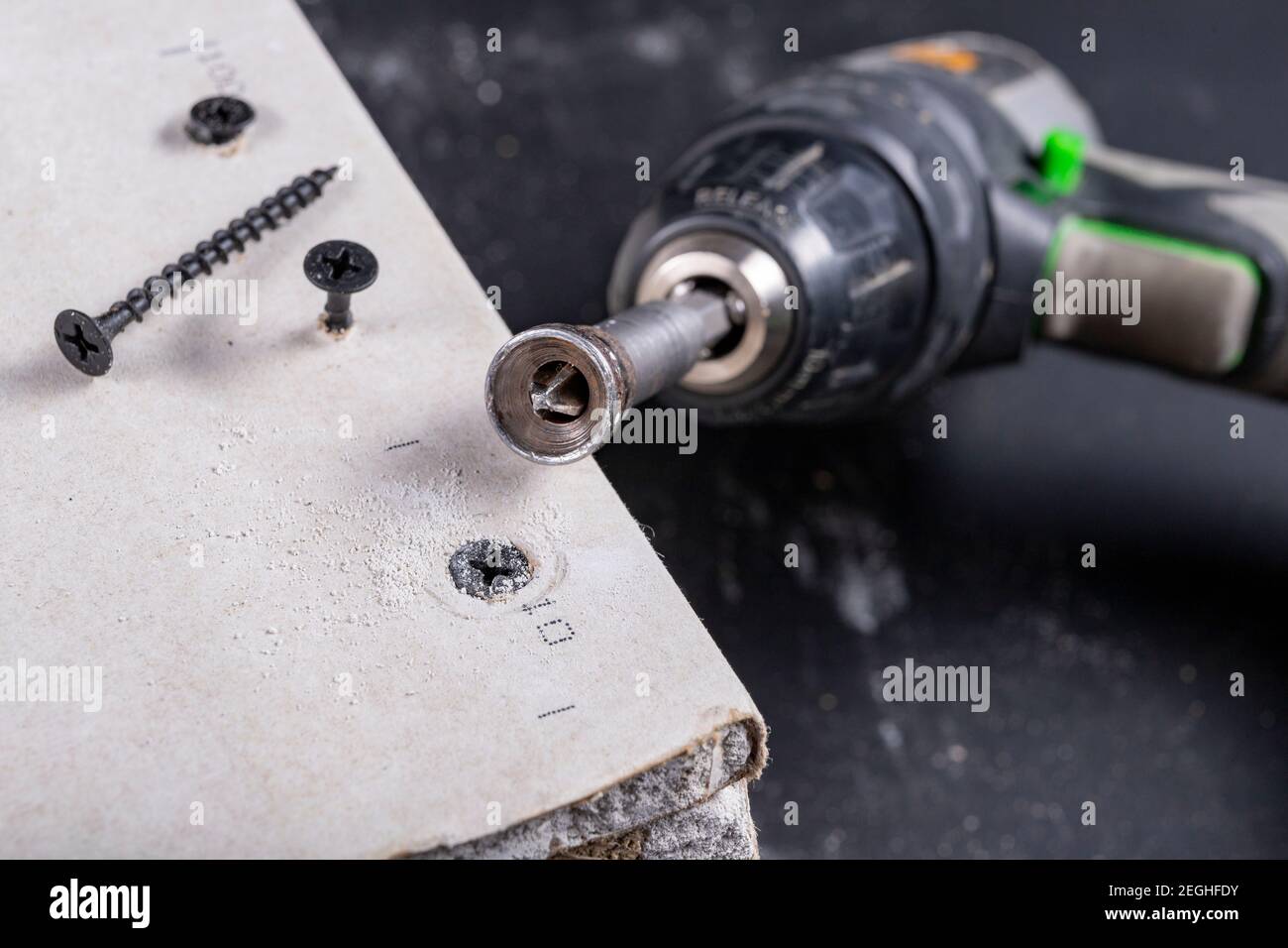 Black screws for fixing plasterboards. Building a wall of drywall