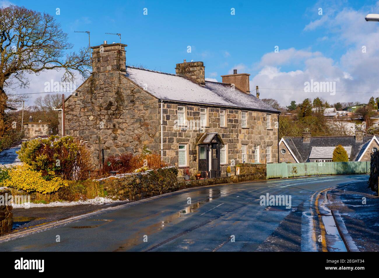 Cottages on the Main Street Llanystumdwy covered with snow on a sunny winters day Stock Photo