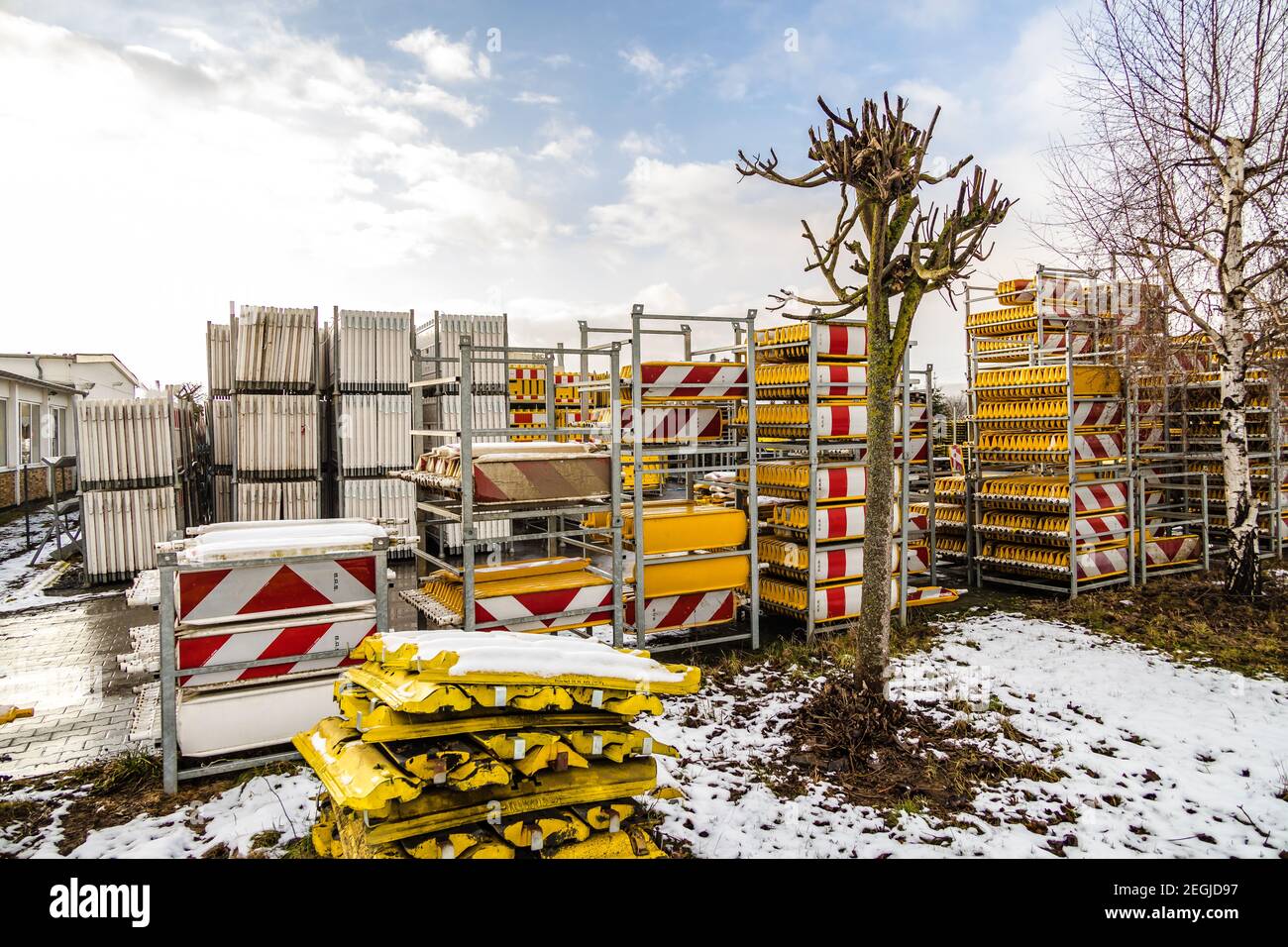 Stack of barrier planks in industrial metal shelves Stock Photo - Alamy