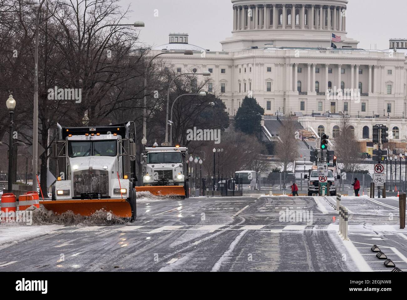 Washington, United States. 18th Feb, 2021. Snow plows make their way down Pennsylvania Ave. as winter storm Viola passes through the Northeast corridor Thursday, February 18, 2021. This is the most widespread snow coverage the U.S. has seen in 17 years. Photo by Ken Cedeno/UPI Credit: UPI/Alamy Live News Stock Photo