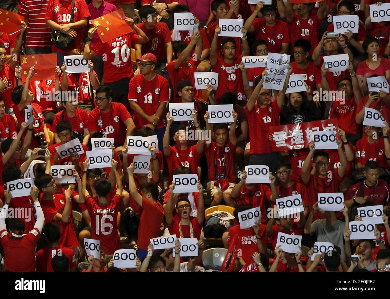 Hong Kong fans hold 'boo' signs, during the Chinese national anthem at the 2018 World Cup qualifying match between Hong Kong and China, in Hong Kong, China November 17, 2015.   REUTERS/Bobby Yip   Picture Supplied by Action Images Stock Photo