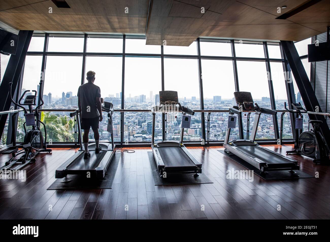 Fitness Trainer Demonstrates Safety with Mask and Social Distancing Stock Photo