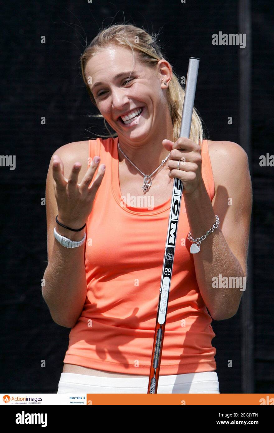 Tennis - Sony Ericsson WTA Tournament - Montreal, Canada - 12/8/06  Nicole Vaidisova of the Czech Republic reacts while being taught how to play hockey by NHL player Vincent Lecavalier (not pictured) during day one at the Rogers Cup, Sony Ericsson WTA Tour  Mandatory Credit: Action Images / Chris Wattie  Livepic Stock Photo