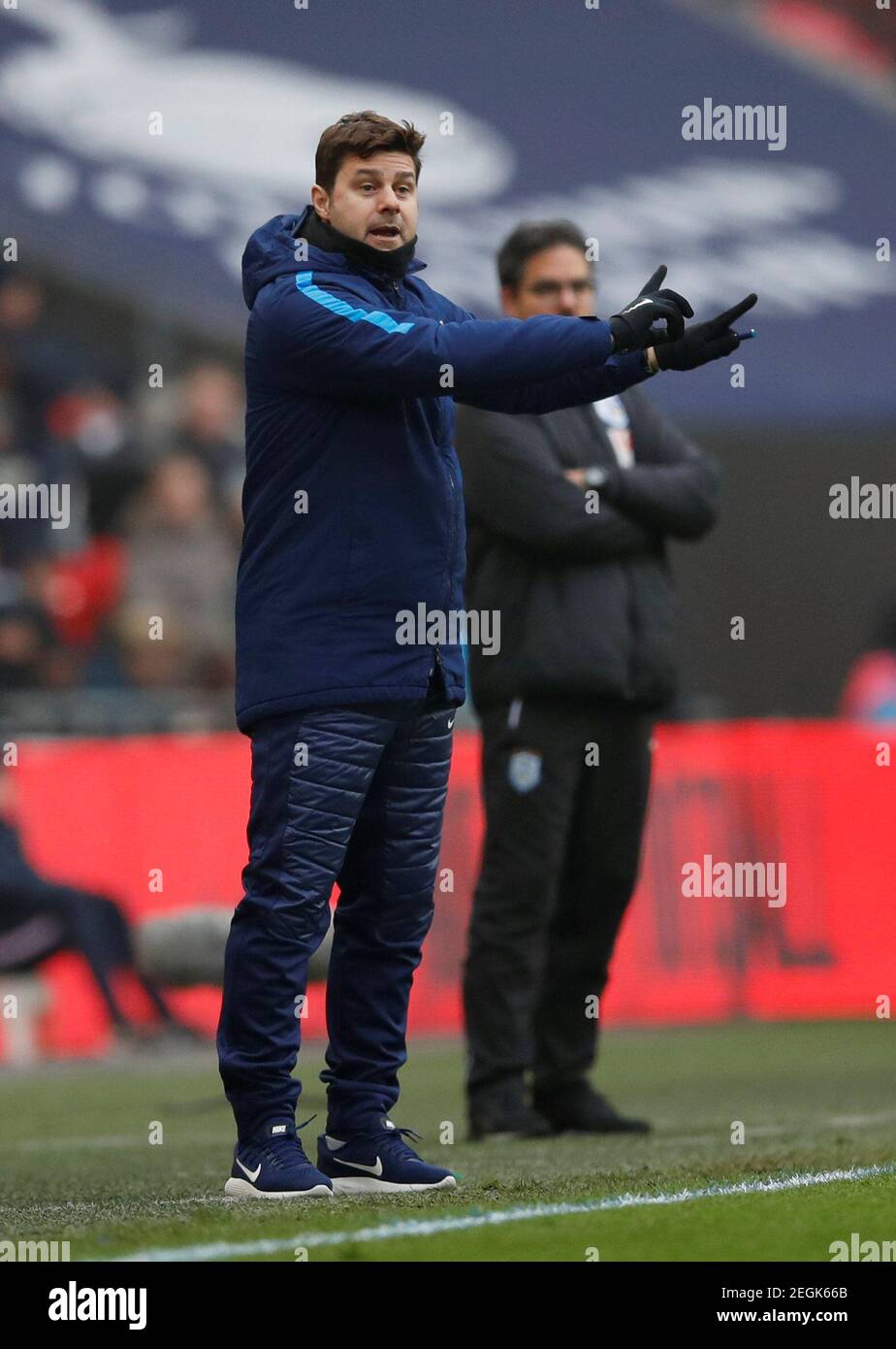 Soccer Football - Premier League - Tottenham Hotspur vs Huddersfield Town - Wembley Stadium, London, Britain - March 3, 2018   Tottenham manager Mauricio Pochettino as Huddersfield Town manager David Wagner looks on   REUTERS/Eddie Keogh    EDITORIAL USE ONLY. No use with unauthorized audio, video, data, fixture lists, club/league logos or 'live' services. Online in-match use limited to 75 images, no video emulation. No use in betting, games or single club/league/player publications.  Please contact your account representative for further details. Stock Photo