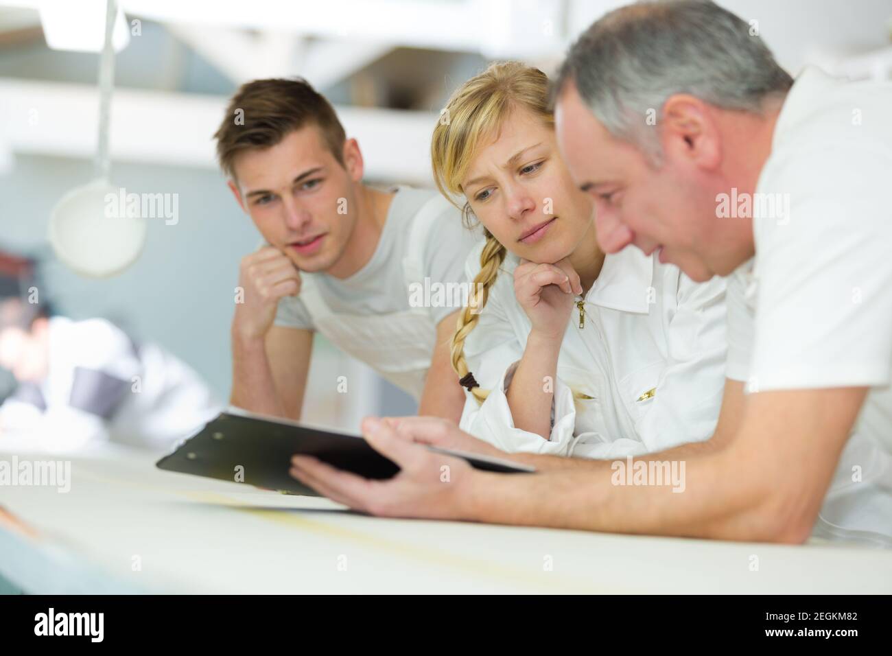portrait of a painter with apprentices Stock Photo
