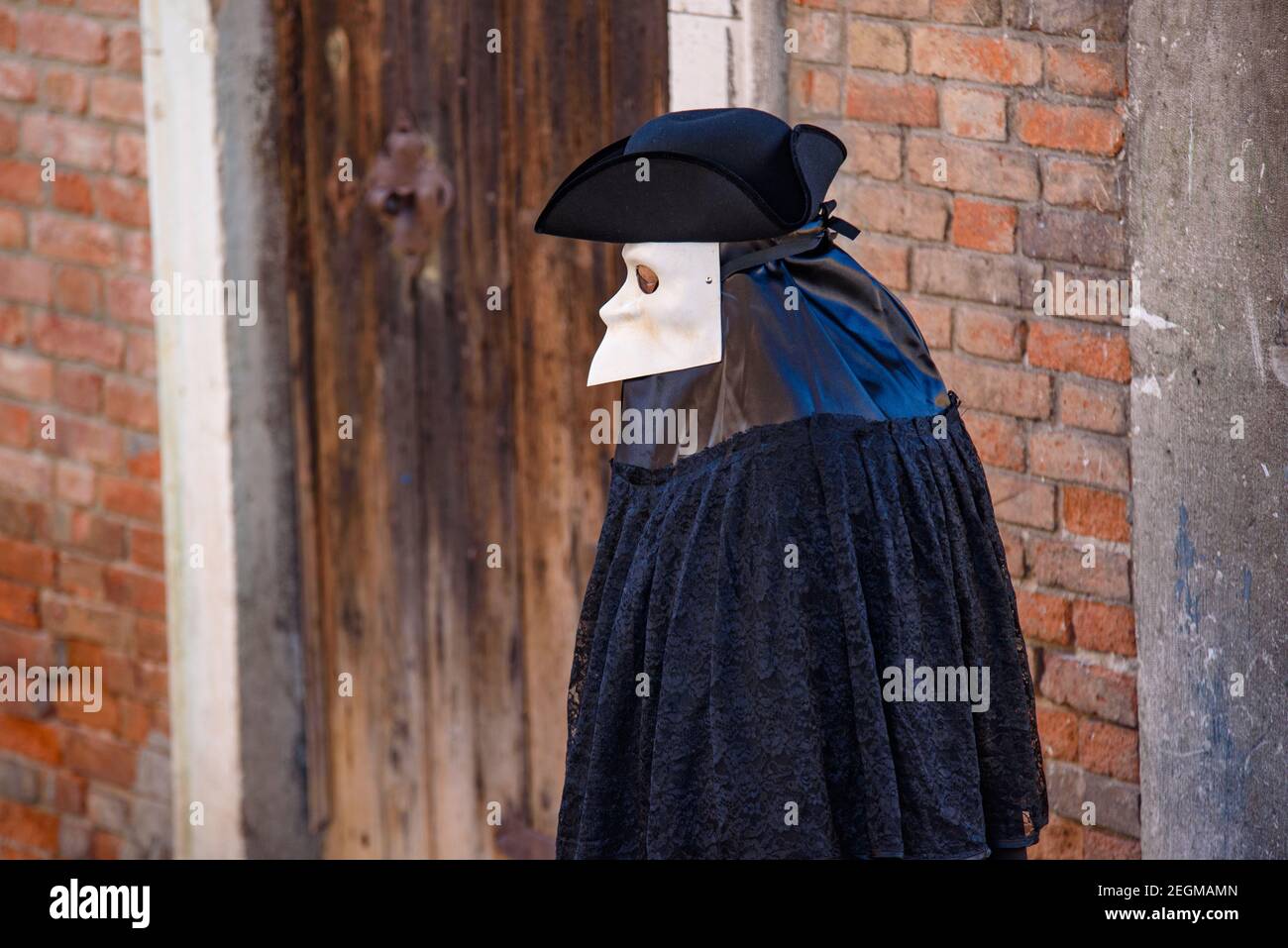 A street performer with Bauta mask in Venice, Italy Stock Photo