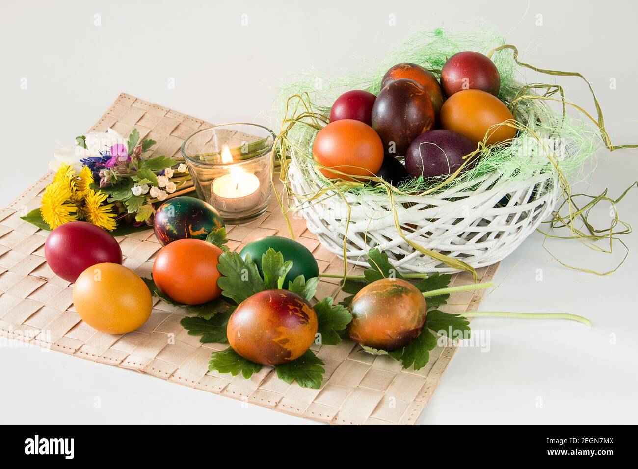 Coloeful Easter eggs and spring flowers on white background Stock Photo ...