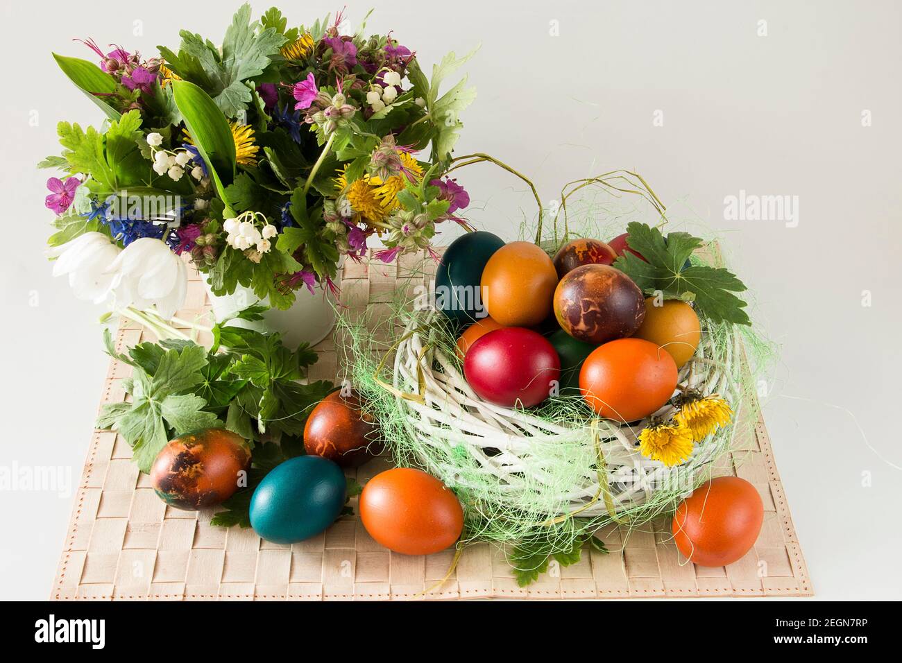 Coloeful Easter eggs and spring flowers on white background Stock Photo ...