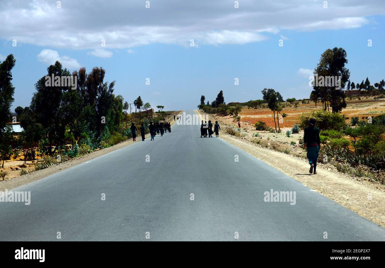 Tigrayan school children walking along the main highway in the Tigray region in northern Ethiopia. Stock Photo