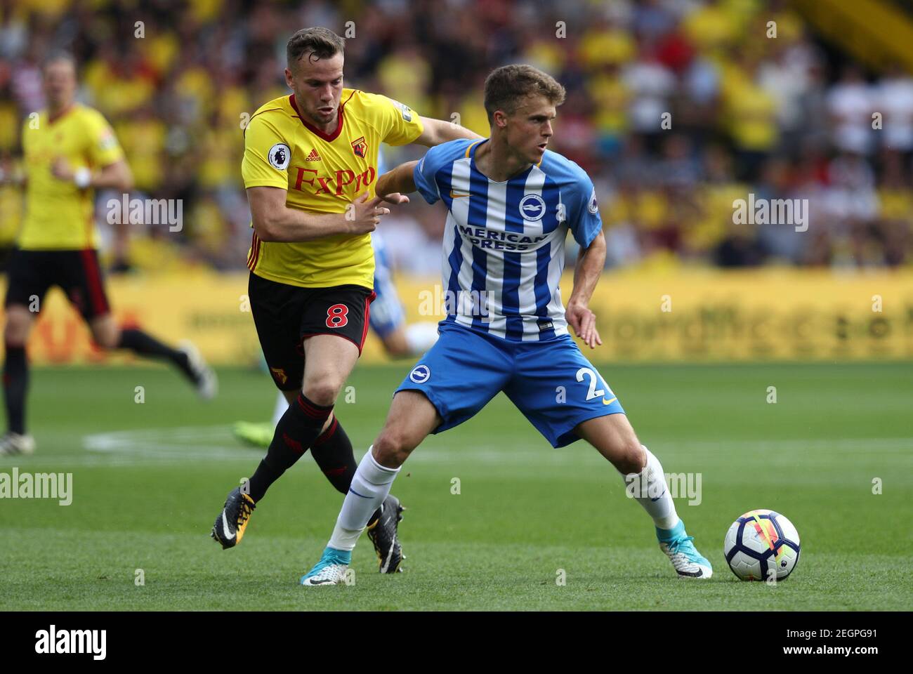 Soccer Football - Premier League - Watford vs Brighton & Hove Albion - Watford, Britain - August 26, 2017   Watford's Tom Cleverley in action with Brighton’s Solly March   REUTERS/Eddie Keogh    EDITORIAL USE ONLY. No use with unauthorized audio, video, data, fixture lists, club/league logos or 'live' services. Online in-match use limited to 45 images, no video emulation. No use in betting, games or single club/league/player publications. Please contact your account representative for further details. Stock Photo