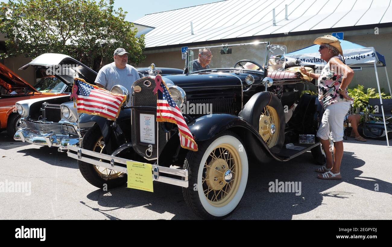 USA, Fort Lauderdale - May 21, 2017 - Restored 1931 Ford model A roadster in black paint with american flags attached to bumper Stock Photo