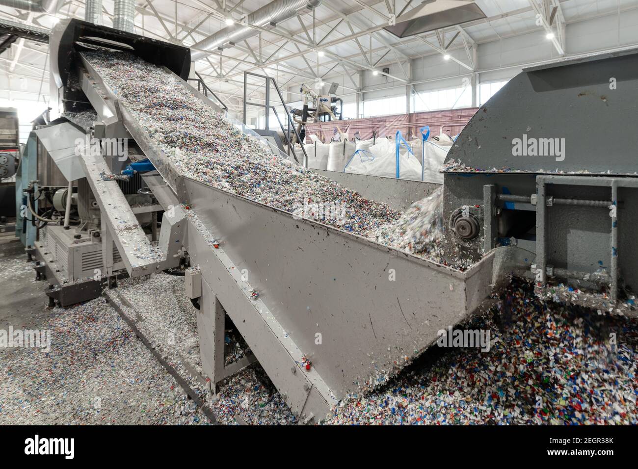 Plastic recycling plant. Conveyor with shredded plastic Stock Photo Alamy