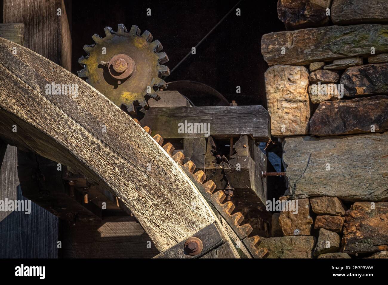 Closeup of the pinion gear driven by the waterwheel of the old grist mill at Historic Yates Mill County Park in Raleigh, North Carolina. Stock Photo