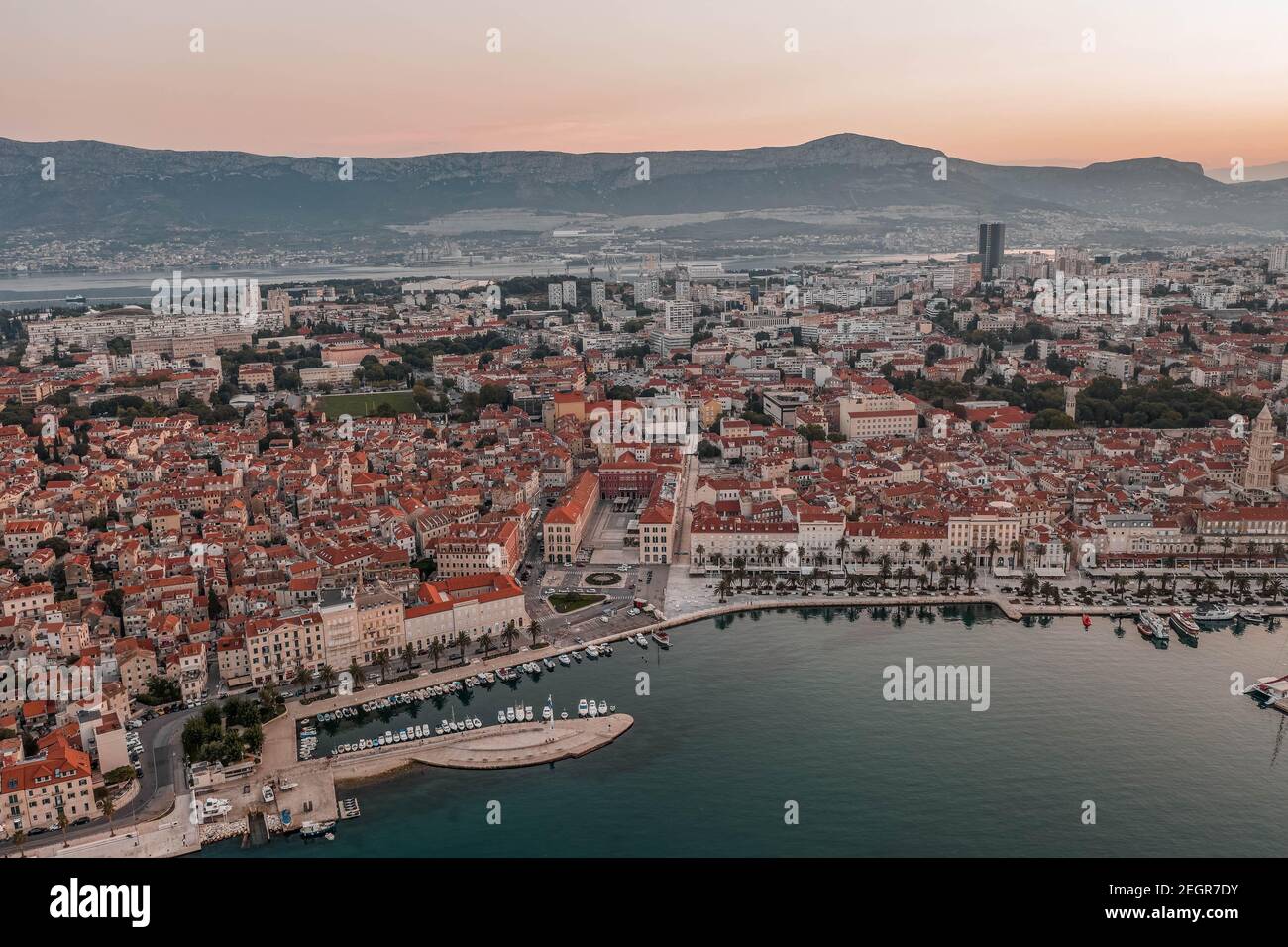 Aerial drone shot of Republic Palace by Diocletian Palace in Split old town before sunrise in morning Stock Photo
