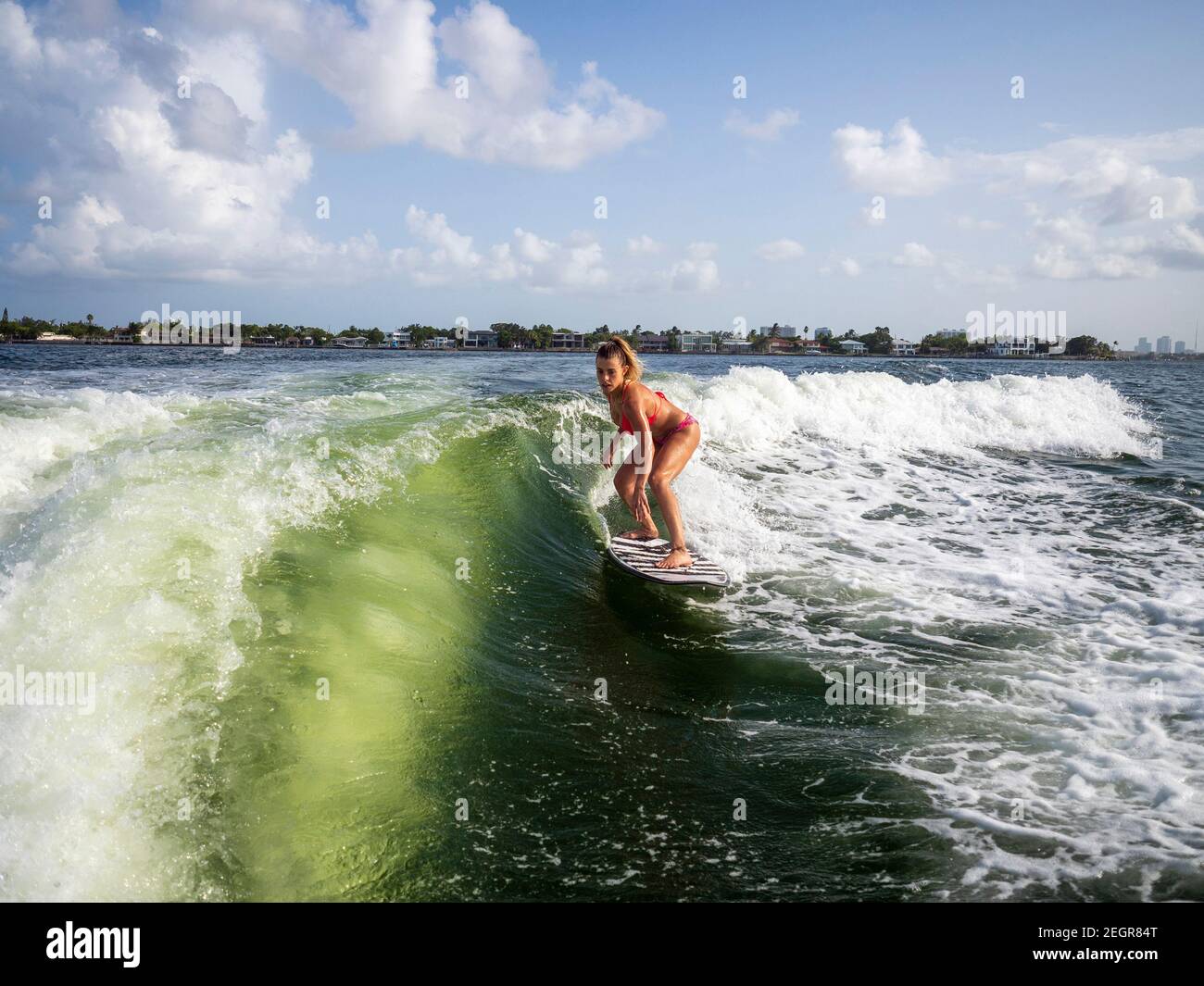 Young girl surfer riding wave hi-res stock photography and images - Alamy