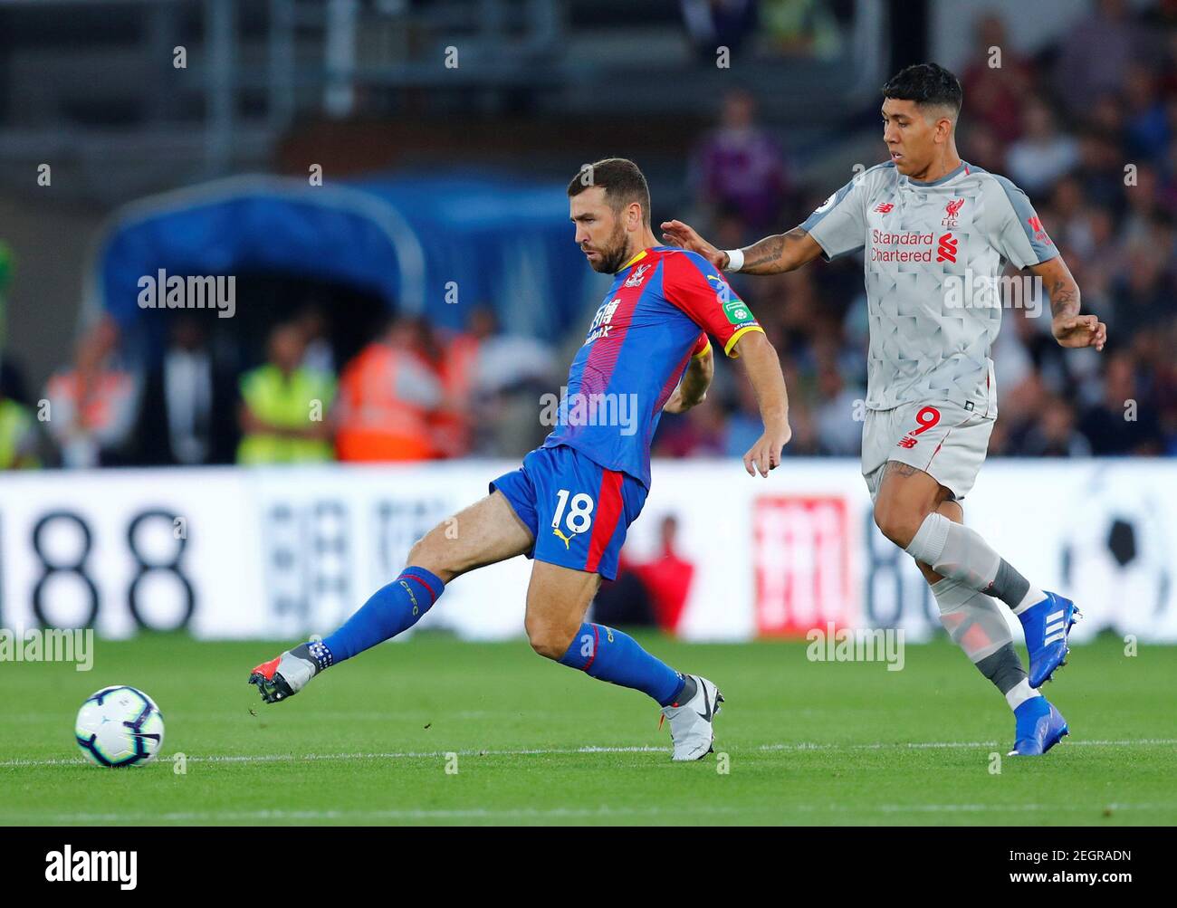 Soccer Football - Premier League - Crystal Palace v Liverpool - Selhurst Park, London, Britain - August 20, 2018  Crystal Palace's James McArthur in action with Liverpool's Roberto Firmino           REUTERS/Eddie Keogh  EDITORIAL USE ONLY. No use with unauthorized audio, video, data, fixture lists, club/league logos or 'live' services. Online in-match use limited to 75 images, no video emulation. No use in betting, games or single club/league/player publications.  Please contact your account representative for further details. Stock Photo