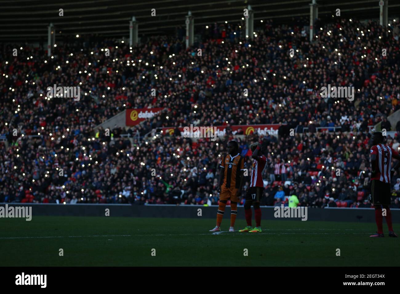 Britain Football Soccer - Sunderland v Hull City - Premier League - The  Stadium of Light - 19/11/16 Mobile phones light up a dimly lit stadium as  players wait on the pitch