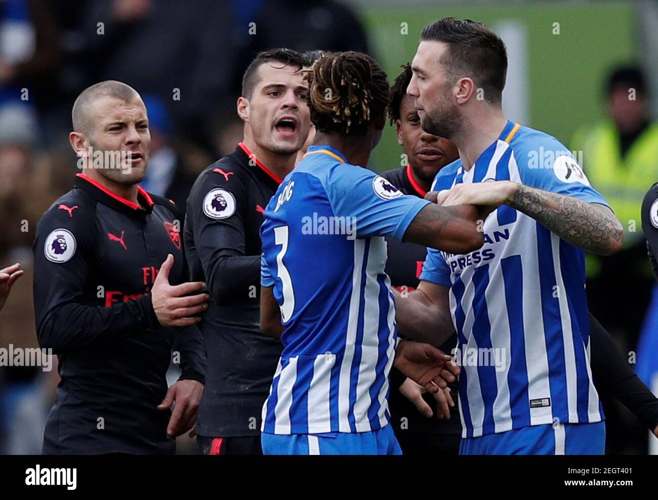 Soccer Football - Premier League - Brighton & Hove Albion vs Arsenal - The American Express Community Stadium, Brighton, Britain - March 4, 2018    Arsenal's Granit Xhaka and Jack Wilshere clash with Brighton's Gaetan Bong after Ezequiel Schelotto sustained an injury in a challenge with Arsenal's Sead Kolasinac    REUTERS/Eddie Keogh    EDITORIAL USE ONLY. No use with unauthorized audio, video, data, fixture lists, club/league logos or 'live' services. Online in-match use limited to 75 images, no video emulation. No use in betting, games or single club/league/player publications.  Please conta Stock Photo