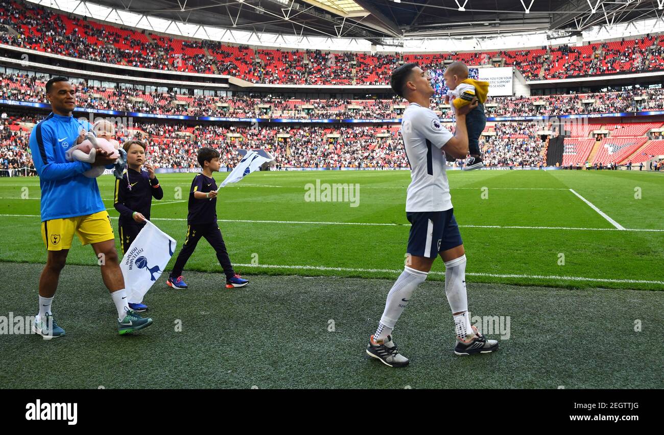 Soccer Football - Premier League - Tottenham Hotspur vs Leicester City - Wembley Stadium, London, Britain - May 13, 2018   Tottenham's Erik Lamela and Michel Vorm with children after the match   REUTERS/Dylan Martinez    EDITORIAL USE ONLY. No use with unauthorized audio, video, data, fixture lists, club/league logos or 'live' services. Online in-match use limited to 75 images, no video emulation. No use in betting, games or single club/league/player publications.  Please contact your account representative for further details. Stock Photo